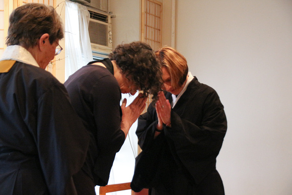 Dharma Holder Jean and Sensei Marisa bow to each other in gratitude