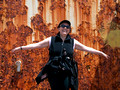 Carolyn in front of a rusty light house.
